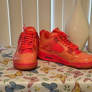 Women’s neon pink Jordan 4 size 8.